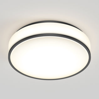 The Artika Giada 15 in. LED modern flush mount light features a white frosted cover and slim black trim, elegantly mounted on a light gray ceiling. Its 5 CCT options make it a versatile choice for contemporary spaces.