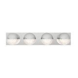 A modern wall-mounted light fixture with four round, chrome-finished lights, each half clear with a textured, sparkling glass design on the bottom half.