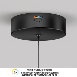 The Artika Corben Pendant LED light 5CCT Black features a central button with a color temperature indicator, a hanging cord, and a label below reading Colour Temperature Switch in English and French.