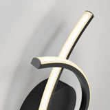 Close-up of a modern wall-mounted LED light fixture featuring two curved, illuminated light bars crossing over each other above a black circular base, with a light gradient on the wall behind.