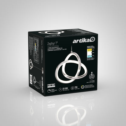 A black Artika Zephyr 1 box featuring an image of a modern, looped LED pendant light. The packaging highlights product features like 50,000 hours lifespan, 700 lumens, and a 3-year warranty.
