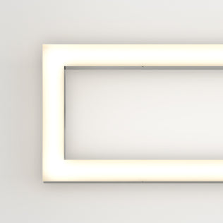 The Artika Dover modern LED bathroom vanity light 5 CCT features a rectangular design with rounded corners, mounted on a plain white wall and emitting a soft, even glow for a sleek, minimalist look.