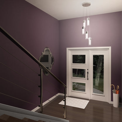 A modern entryway with purple walls, a white glass-panel door, geometric rug, umbrella stand, wall mirror, and Artika Hologram 5-light LED pendant lighting beside a dark staircase with cable railing.