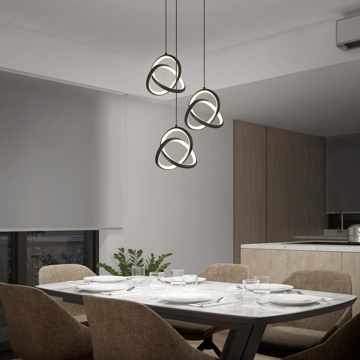A modern dining room features a marble table for four, beige contemporary chairs, and the Artika Zephyr 3-light LED pendant above. A plant is by the window with the kitchen visible in the background.