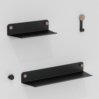 The Artika Sonokit set includes two minimalist black metal shelves and two hooks with wooden accents for Sonolok and Sonofold wall panels, offering quick installation and sleek design ideal for any modern space.