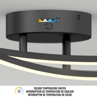 Close-up of the Artika Orly modern LED bathroom vanity light 3 CCT, featuring a color temperature switch with white, yellow, and blue labels. Instructions in English, French, and Spanish—perfect for contemporary spaces.