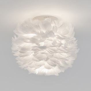 The Artika Plume LED flush mount light features soft white feathers for a fluffy, cloud-like look, making it a unique modern ceiling fixture.