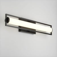 The Rialto modern LED bathroom vanity light 3 CCT by Artika features a dimmable cylindrical white light tube in a sleek rectangular black frame, elegantly mounted on a plain white wall.