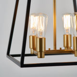 Close-up of a modern hanging light fixture with exposed Edison bulbs, gold sockets, and a black geometric metal frame against a plain light background.