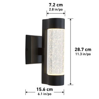 The Artika Bubble Element LED indoor-outdoor light is a black wall-mounted fixture with a cylindrical glass center featuring bubble-like details. Dimensions: 28.7 cm tall, 15.6 cm wide, and 7.2 cm deep.