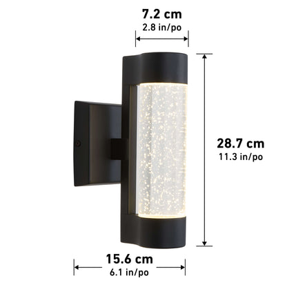 The Artika Bubble Element LED indoor-outdoor light is a black wall-mounted fixture with a cylindrical glass center featuring bubble-like details. Dimensions: 28.7 cm tall, 15.6 cm wide, and 7.2 cm deep.