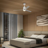 Modern bedroom with wood-paneled walls and ceiling, a double bed with neutral bedding, a potted plant, abstract wall art, large window with city view, and a white ceiling fan with light.