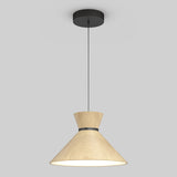 A modern pendant light with a black ceiling mount, a thin black cord, and a wide, conical wooden lampshade that emits a soft, warm glow. The background is plain light gray.