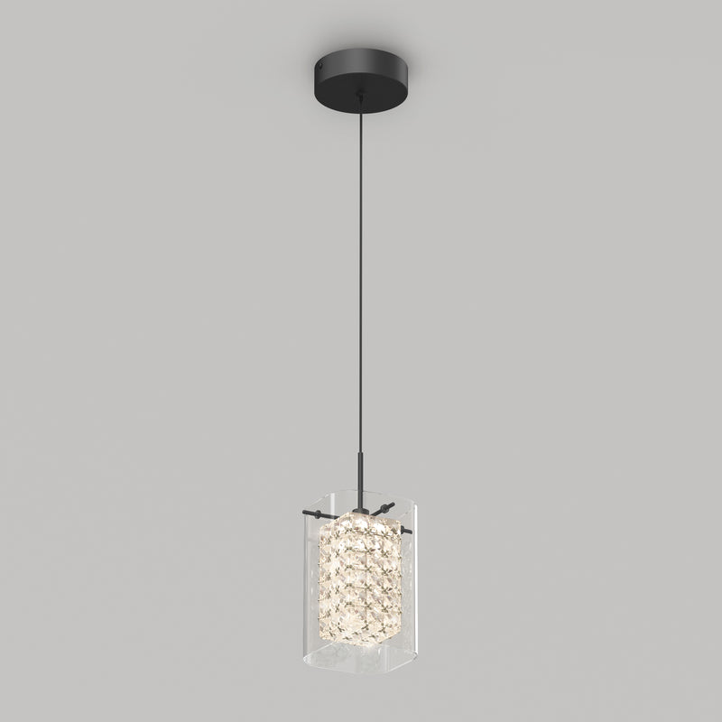 The Artika Crystal Cube 1-light LED pendant light features a black ceiling mount and cord with a cylindrical, textured glass shade that diffuses the light, shown against a plain gray background.