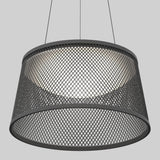 A modern pendant light with a wide, black metal mesh shade, suspended by two thin cables against a plain gray background. The light inside creates a soft glow through the mesh pattern.