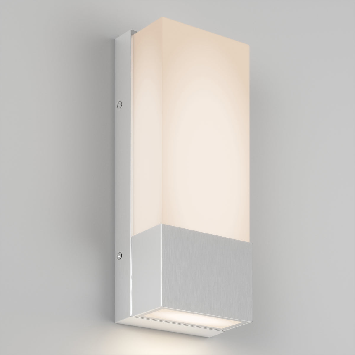 The Artika Dixon indoor-outdoor LED wall light features a rectangular frosted white shade and a brushed metallic base, mounted on a light grey wall, providing a soft, diffused glow.