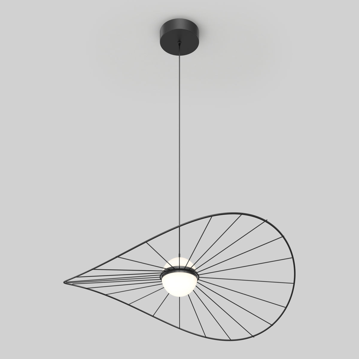 The Tolena LED pendant light 3 CCT by Artika features a circular bulb suspended by a thin cord, with an asymmetrical wireframe shade resembling a stylized leaf or abstract geometric form.