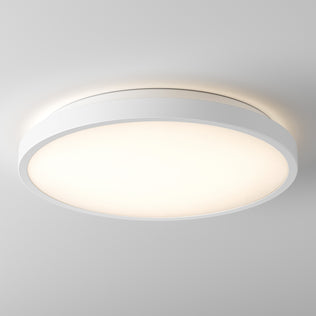 The Artika Isara 12 in. RGBIC LED Flush Mount shines with a sleek white frame against a plain white ceiling.