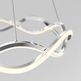 A modern, sculptural pendant light with intertwined, curving metallic bands and integrated LED strips hangs from thin cables against a plain, light gray background.