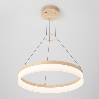 The Artika Optical LED pendant light 3 CCT features a modern circular design with a wooden frame and glowing white ring, suspended by four cables from a matching wood ceiling mount, creating a minimalist statement against a light gray background.