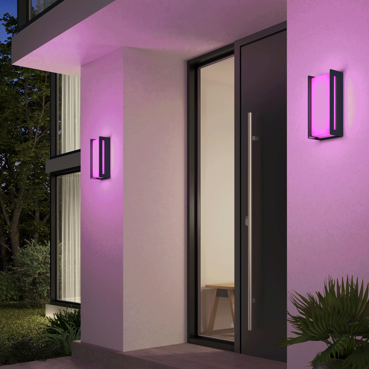 A modern house entrance features two Artika Ryker smart RGB indoor-outdoor wall lights emitting pink-purple light on either side of a glass door; a bench is visible inside, with plants and trees outside.