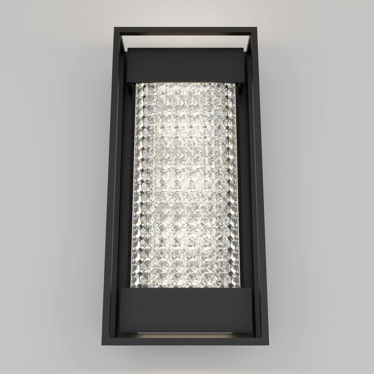 The Artika Glam indoor-outdoor LED wall light features a black metal frame and a central panel of sparkling crystal-like elements, casting bright illumination against any plain gray wall.