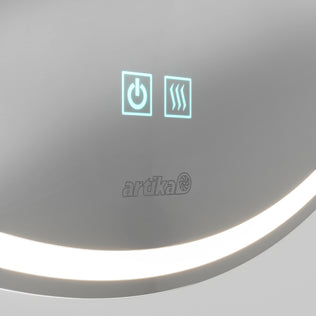 Close-up of Artika’s Emeraude 24x24 in. Anti-Fog LED Mirror touch panel with power and steam icons on a sleek surface.