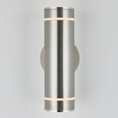 The Artika C7 indoor-outdoor wall light is a modern cylindrical brushed metal sconce, emitting soft white light from narrow top and bottom bands, mounted on a circular base against a plain light background.