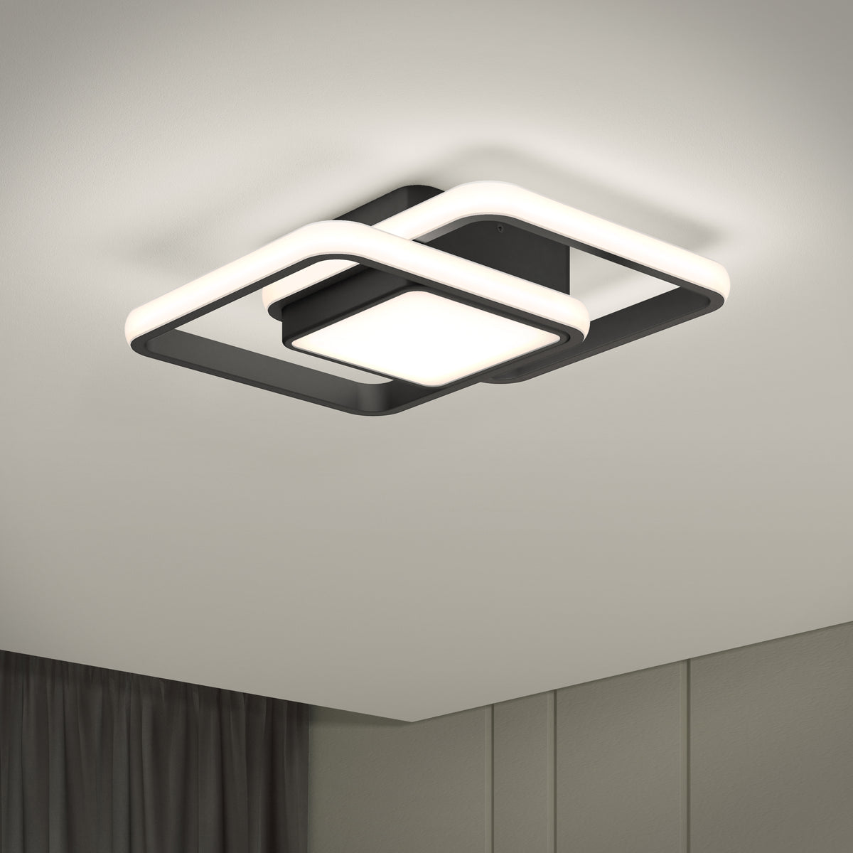 The Artika Romeson 11 in. LED modern flush mount light 5 CCT features a black and white geometric design, emits a soft glow, and complements light-colored walls, ceiling, and dark curtains.
