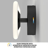 A wall-mounted square LED light with a visible side switch for adjusting color temperature. The switch has a color gradient and icons, with English and French text below describing it as a Colour Temperature Switch.