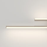 Minimalist image featuring two horizontal LED light fixtures mounted on a plain white wall, emitting a soft, warm glow. The lights are parallel with one above and shorter than the other.