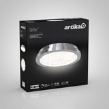 A black box featuring an Artika Glitter LED ceiling light fixture with a modern circular design. The box shows product images, key features, and specifications in English, French, and Spanish.
