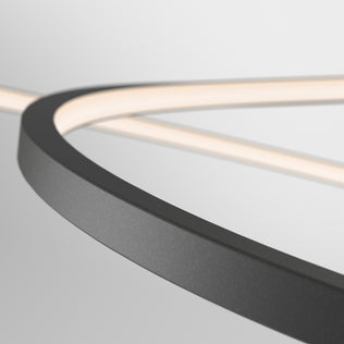 Close-up of the Salto LED pendant light by Artika, featuring a modern curved matte black frame and integrated LED strip, set against a plain white background.