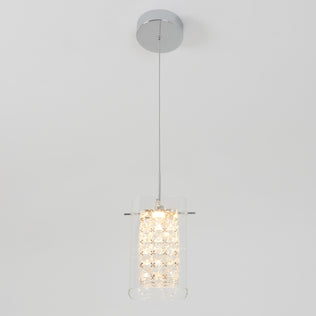 The Artika Crystal Cube 1-light LED pendant features a cylindrical glass shade with crystal-like accents, suspended by a thin wire from a chrome ceiling mount, shown against a plain white background.