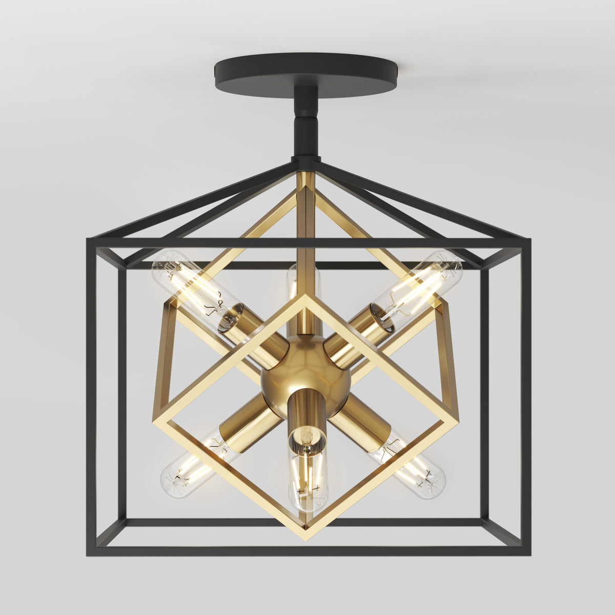 A modern ceiling light fixture with exposed bulbs, featuring intersecting black and gold geometric cubes for a contemporary design.