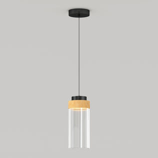 The Artika Hanson 1-light LED Pendant 5 CCT features a black ceiling mount, black cord, and a cylindrical glass shade with a wooden accent near the top, shown against a plain light gray background.