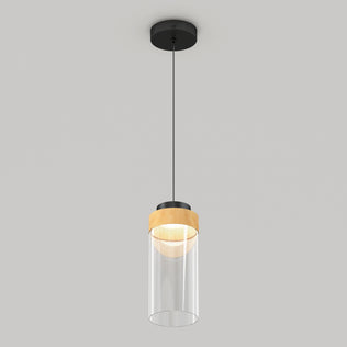 The Artika Hanson 1-light LED pendant features a black ceiling mount, black cord, wooden accent, and cylindrical clear glass shade, shown against a plain light gray background.
