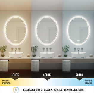 The Artika Corby 22 in. x 28 in. LED mirror shows selectable lighting—warm white (3000K), neutral white (4000K), and cool white (5000K)—with each setting displayed above a modern sink, highlighting its 3 CCT and defogger features.