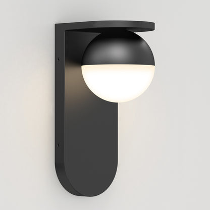 The Artika Bloom indoor-outdoor LED wall light 3 CCT features a modern black sconce with a rounded vertical base and a half-covered spherical fixture, shown mounted on a white wall.