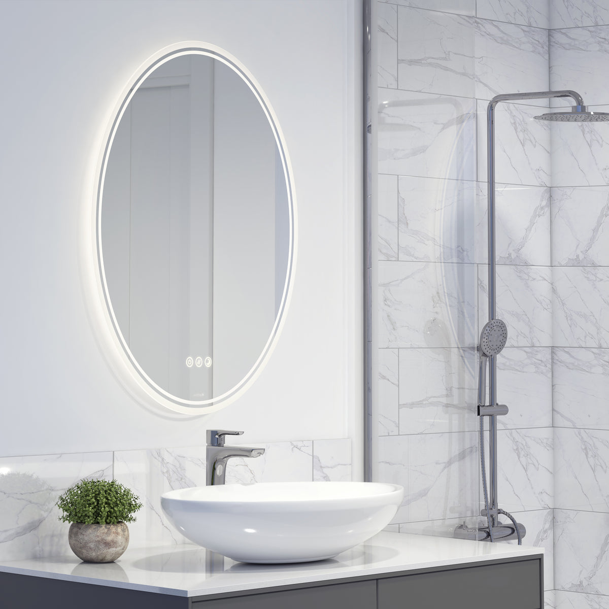 Modern bathroom with a round illuminated mirror, white vessel sink, chrome faucet, small potted plant, and a glass-enclosed shower with a handheld showerhead against white marble tile walls.