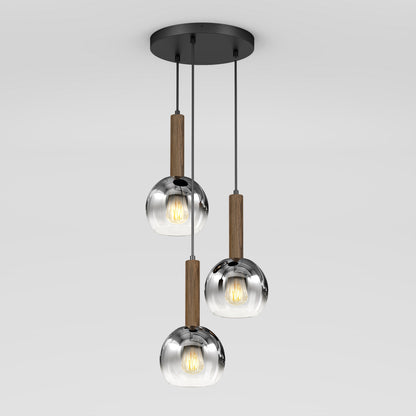 The Artika Ardel Spiral 3-Light Pendant features three hanging lights with round, transparent glass shades and wooden accents, all suspended from a circular black base. Bulbs are not included.