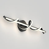 A modern wall light fixture with a black circular base and a linear LED light, accented by a looping, spiral-shaped glowing element around the main bar, mounted on a plain light-colored wall.