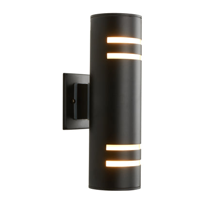 The Artika V3 indoor-outdoor wall light is a modern black cylinder with horizontal slits, casting warm light up and down from a rectangular backplate, shown against a white background.
