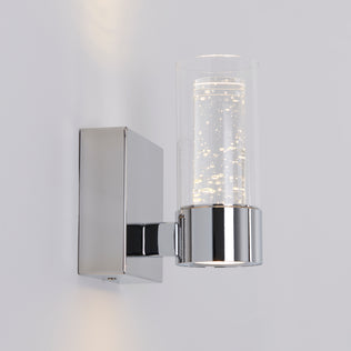 Artika’s Essence 1-light LED vanity light features a chrome base and bubble glass, ideal for accenting any white wall.