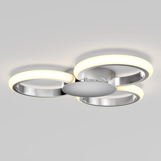 The Artika Nyala 15 in. LED flush mount light features three circular LED rings and a metallic chrome finish, all mounted on a round base for modern ceiling style.