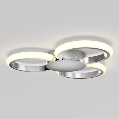 The Artika Nyala 15 in. LED flush mount light features three circular LED rings and a metallic chrome finish, all mounted on a round base for modern ceiling style.