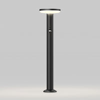 The Artika Urbia Solar LED Bollard features a round lit top, central button, and sleek black design against a plain light background.