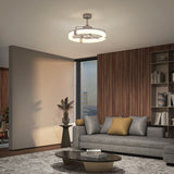 Modern living room with a gray sofa, coffee table, and ceiling fan.
