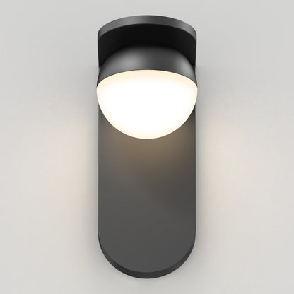 The Artika Bloom indoor-outdoor LED wall light 3 CCT features a modern design with a matte black base and rounded white dome, casting a soft, warm glow against light gray walls.