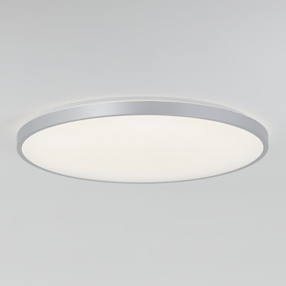 The Artika Europa 21 in. LED modern flush mount light features a flat white diffuser and metallic silver rim, seamlessly mounted on a plain white ceiling. Includes remote control for added convenience.